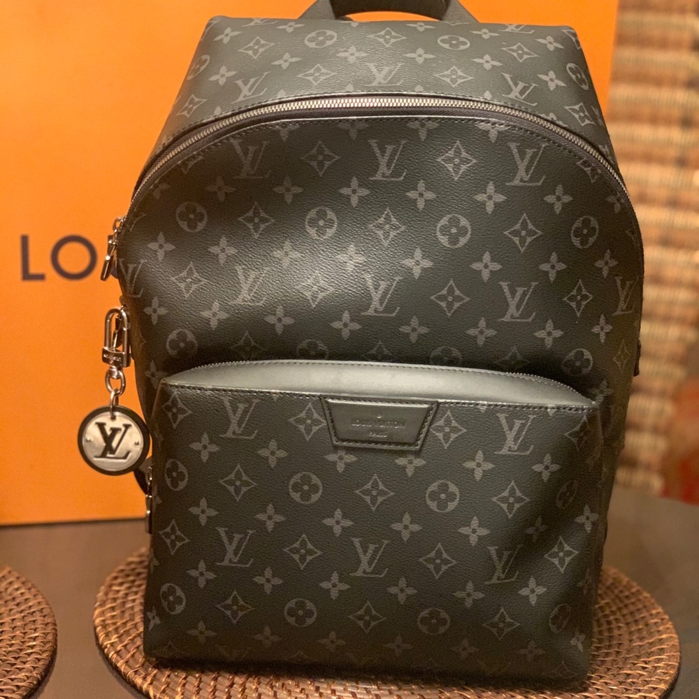 Louis Vuitton Discovery pm backpack with Lv charm